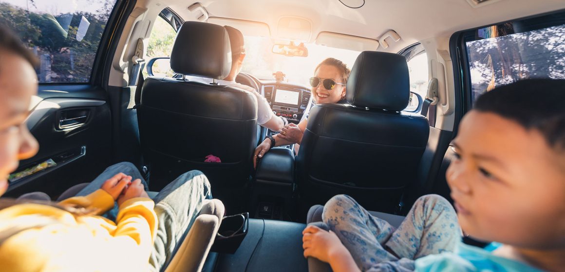 Auto loan after bankruptcy A family driving together, representing rebuilding with an auto loan after bankruptcy