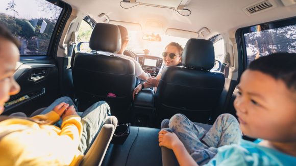 Auto loan after bankruptcy A family driving together, representing rebuilding with an auto loan after bankruptcy